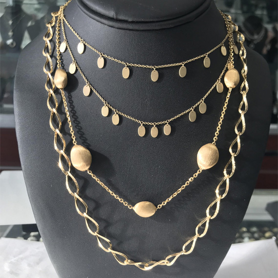 A Collection of 14K White, Yellow Gold and Diamond Pendants and Necklaces