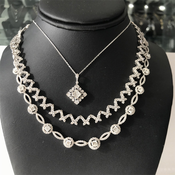 A Collection of 14K white/yellow gold and diamond fine necklaces